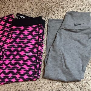 Two pairs Nike Women Dri-Fit capri tights/leggings size medium